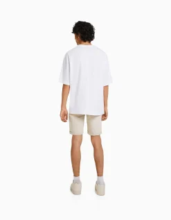 BERSHKA Bermuda denim skinny retroussé Bleu Flash Sale