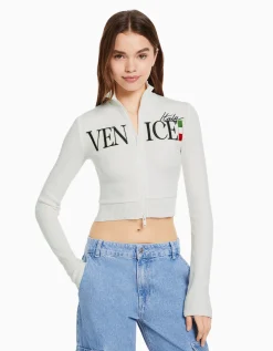 BERSHKA Gilet manches longues broderie fermeture Éclair Écru Flash Sale