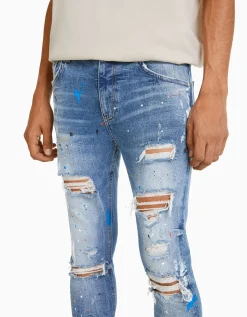 BERSHKA Jean skinny déchirures taches de peinture Bleu lavé Flash Sale