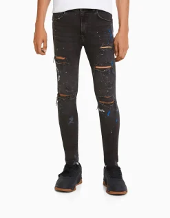 BERSHKA Jean skinny déchirures taches de peinture Bleu lavé Cheap