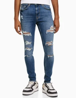 BERSHKA Jeans super skinny déchirés Bleu Hot