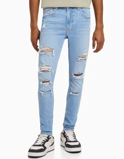BERSHKA Jeans super skinny déchirés Bleu Outlet