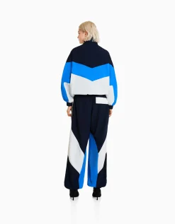 BERSHKA Pantalon jogger molleton effet nylon color block Bleu Best