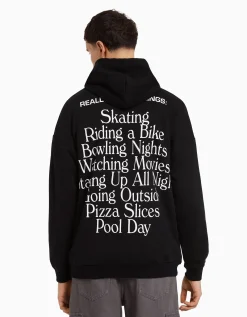 BERSHKA Sweat capuche easy fit imprimé Noir Hot