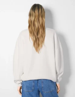 BERSHKA Sweat col montant zippé imprimé Bleu foncé Store