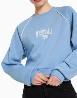 BERSHKA Sweat col rond imprimé contraste Bleu Hot