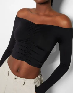 BERSHKA Top cropped manches longues col style Bardot fronces Noir Store